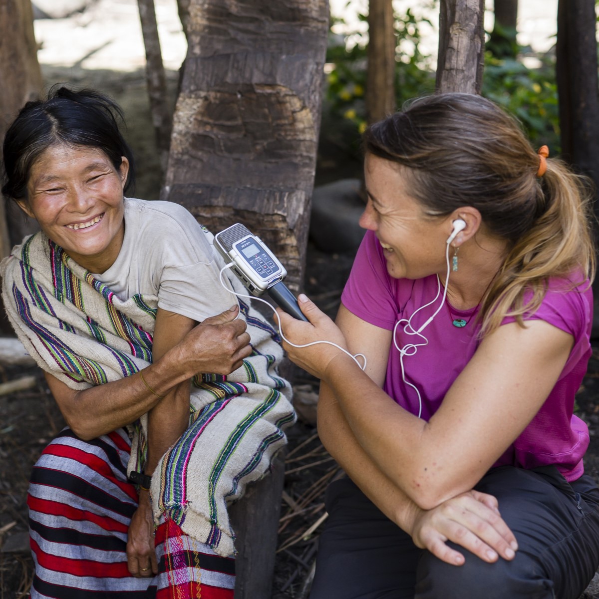 A woman is talking to someone on the phone.